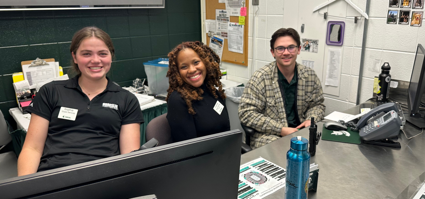 Students working at the Guest Services counter